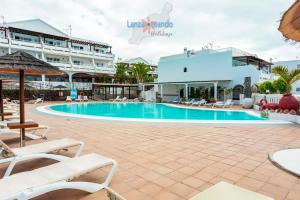 Bazén v ubytování Vivienda Vacacional Sea Garden nebo v jeho okolí