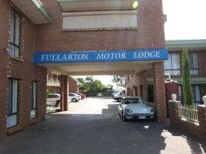 a car parked in a parking lot under a garage at Fullarton Motor Lodge in Adelaide