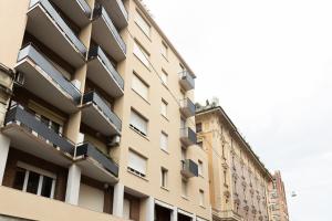 un edificio alto con balconi sul lato di Montebello, Bologna by Short Holidays a Bologna