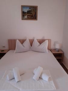 Un pat sau paturi într-o cameră la CASA MARIA