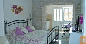 Postel nebo postele na pokoji v ubytování Apartments Djurdjica