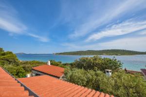a view of the ocean from the roofs of houses at House Majka Marija in Tkon