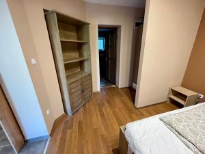 A bed or beds in a room at Happy Home Apartman