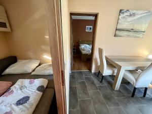 A bed or beds in a room at Happy Home Apartman