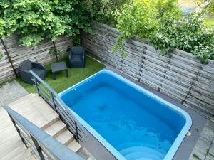 The swimming pool at or close to Happy Home Apartman
