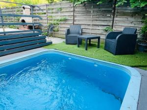 The swimming pool at or close to Happy Home Apartman