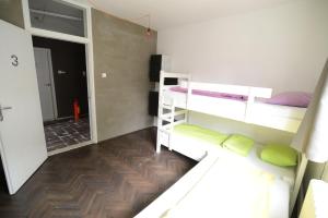 a room with two bunk beds and a hallway at Hostel Fair and Square in Belgrade
