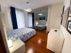 a bedroom with a bed and a mirror at Relais tra gli Ulivi in Ortona +49 photos