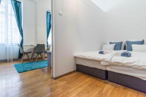 Posteľ alebo postele v izbe v ubytovaní Adele's Apartment Close To Danube and Fashion Street
