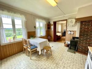 Posezení v ubytování Landlig leilighet + 13 fotografií
