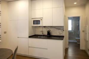 Kuchnia lub aneks kuchenny w obiekcie Apartamentos La Quinta