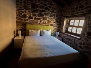 Postel nebo postele na pokoji v ubytování Casa da Mãe - Izei