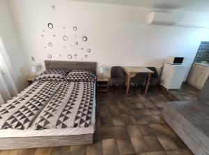 Posteľ alebo postele v izbe v ubytovaní Vasti Apartman
