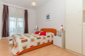 Postel nebo postele na pokoji v ubytování Apartments Bee Maja + 34 fotografií