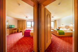 Postel nebo postele na pokoji v ubytování Biohotel Rastbichlhof