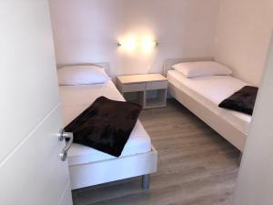 Posteľ alebo postele v izbe v ubytovaní Apartments Vedran