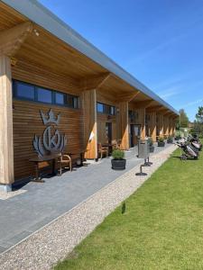 a building with a sign on the side of it at Rammal Lodge - Entire home, self catering apartment in Inverness in Inverness