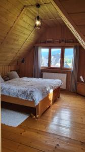 Tempat tidur dalam kamar di U Kowalskich - pokoje i apartamenty