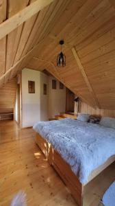 Llit o llits en una habitació de U Kowalskich - pokoje i apartamenty