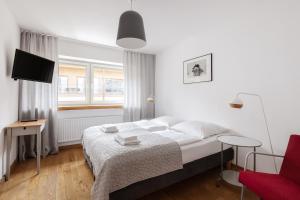 Posteľ alebo postele v izbe v ubytovaní Apartament z Widokiem