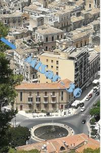 an aerial view of a city with a building at Misar-36 in Modica