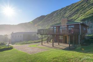 a house with a deck and a mountain at 29@Kamma in Eersterivierstrand