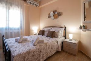 A bed or beds in a room at Libyan Sea Luxury Apartment 1