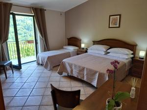 A bed or beds in a room at Agriturismo Cupiglione