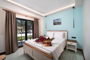a bedroom with a bed with flowers on it at MELİTYA Hotels in Kalekoy +48 photos