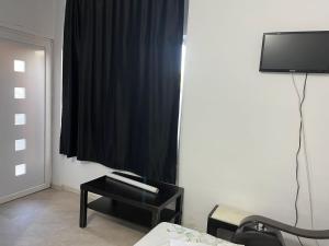 TV a/nebo společenská místnost v ubytování Casa Vio parter