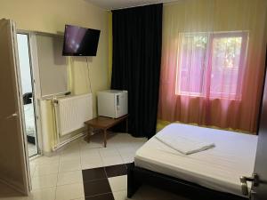 Postel nebo postele na pokoji v ubytování Casa Vio parter