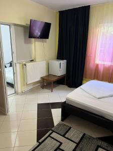 Postel nebo postele na pokoji v ubytování Casa Vio parter