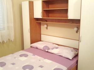 Postel nebo postele na pokoji v ubytování Apartments Mira