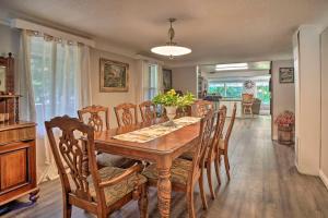 a dining room with a wooden table and chairs at Outdoor Adventure Tranquil Creekside Retreat in Merlin