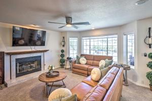 a living room with a couch and a fireplace at Luxe Home with Detached Casita and Furnished Patio! in Bullhead City