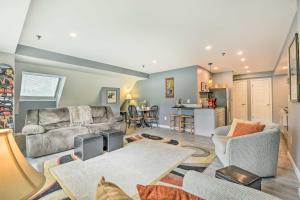 a living room with a couch and a kitchen at Killington Vacation Gem Walk to Ski Lifts! in Killington +25 photos