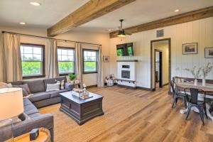 a living room with a couch and a table at Charming Lodi Retreat Walk to Local Wineries in Lodi