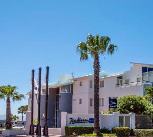a building with palm trees in front of it at 515 The Granger in Cape Town