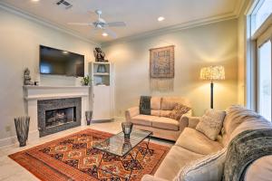 a living room with a couch and a fireplace at Adorable New Orleans Home about 6 Mi to Uptown! in New Orleans
