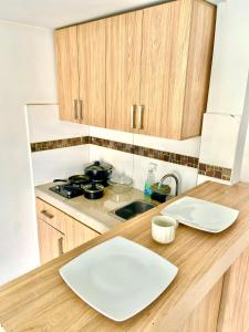Una cocina o zona de cocina en Estancia casa gris primer piso privado Jm