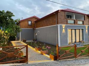 a house with a fence in front of it at Sky Villas Hisar in Trabzon