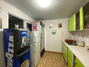 a kitchen with a pepsi and a soda machine at Aurora Glamping in Vama Veche