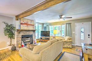 a living room with two couches and a fireplace at Secluded Chattanooga Getaway with Deck and Yard! in Chattanooga