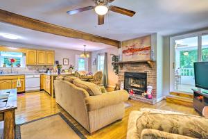 a living room with two couches and a fireplace at Secluded Chattanooga Getaway with Deck and Yard! in Chattanooga