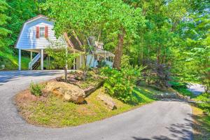 a house with a road in front of it at Secluded Chattanooga Getaway with Deck and Yard! in Chattanooga