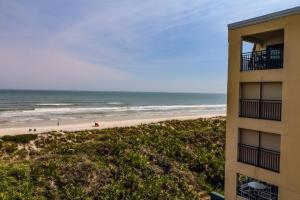 a view of the beach from the balcony of a building at Windjammer 307 in Saint Augustine