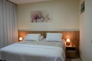 Un ou plusieurs lits dans un hébergement de l'établissement Hotel Monte Carlo