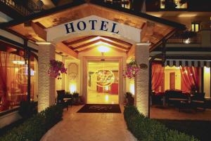 a hotel entrance with a sign that reads hotel at Fashion Hotel in Valmontone