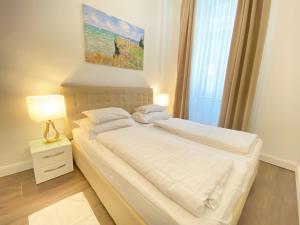 Posteľ alebo postele v izbe v ubytovaní Steiner Residences Vienna Taborstrasse