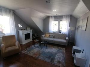 a living room with a couch and a fireplace at Romantische Ferienwohnung in Bad Breisig